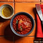 Home 19 퓨전 치킨의 양념 제조 과정 - A vibrant close-up of a freshly prepared homemade barbecue chicken sauce in a rustic Spanish kitchen...
